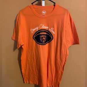 47 Stoney Clover Lane t-shirt featuring the logo of the Chicago Bears NFL team